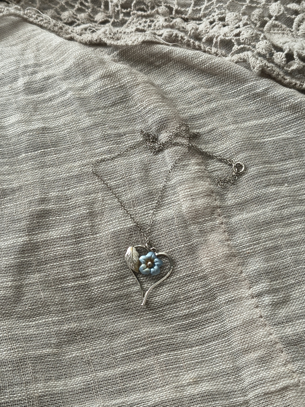 Silver Heart Pendant Necklace with Blue Flower Accent